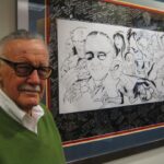 Stan Lee Instagram - Stan always admired artists, from those he worked closely with to the fans who created sensational Stan art. Here’s a flashback of him posing with a phenomenal piece crafted by Charles Holbert. #StanLee #WorldArtDay