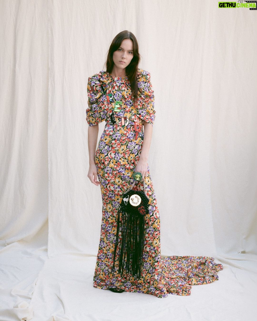 Stella McCartney Instagram - STELLA’S SUSTAINABLE MARKET: I have known @AndrewLoganSculptor since I was a kid, he was in my parents' group. He is an English art icon and I’m a massive fan; I have some of his pieces and always wanted to collaborate with him. This season it happened and I’m so thrilled he created exclusive wearable art for the runway show using recycled glass. It’s the spirit of youth and life. It’s everything I want to live and be, this is what we should all be surrounded by. x Stella Wearable art by #AndrewLogan is featured on painted florals and knotted mesh #Falabella bags, crafted from #vegan materials. Discover the full #StellaSummer24 runway collection at stellamccartney.com. #StellaMcCartney #ParisFashionWeek #PFW #crueltyfree