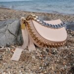 Stella McCartney Instagram - STELLA X PHIA: In celebration of the @WTA’s 50th anniversary, we partnered with Phia on two limited-edition #Frayme bags – with a percentage of proceeds supporting next-gen female athletes.   Only 73 of these numbered, rare Frayme bags were made – featuring chain handles and crystal-embellished ribbons inspired by the iconic tennis bracelet. This serves as a powerful feminist symbol in sports history, stemming from Chris Evert famously dropping her eternity diamond bracelet on the US Open tennis court in 1978.   Phia is a forthcoming digital platform transforming the fashion industry from co-founders @SophiaKianni and @PhoebeGates. They will be mentored by Stella, supporting the next generation of female innovators.   The Stella McCartney x Phia Frayme bags can be shopped exclusively from our New York City Soho boutique at 112 Greene Street.   #StellaMcCartney #Phia #WTA #USOpen