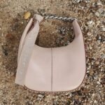 Stella McCartney Instagram - STELLA X PHIA: In celebration of the @WTA’s 50th anniversary, we partnered with Phia on two limited-edition #Frayme bags – with a percentage of proceeds supporting next-gen female athletes.   Only 73 of these numbered, rare Frayme bags were made – featuring chain handles and crystal-embellished ribbons inspired by the iconic tennis bracelet. This serves as a powerful feminist symbol in sports history, stemming from Chris Evert famously dropping her eternity diamond bracelet on the US Open tennis court in 1978.   Phia is a forthcoming digital platform transforming the fashion industry from co-founders @SophiaKianni and @PhoebeGates. They will be mentored by Stella, supporting the next generation of female innovators.   The Stella McCartney x Phia Frayme bags can be shopped exclusively from our New York City Soho boutique at 112 Greene Street.   #StellaMcCartney #Phia #WTA #USOpen