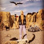 Steve Austin Instagram - 🔊⬆️ For #tbt here’s an old photo from my @wwe days. This was the third or fourth vest of around 15 that @terrysews2 and I collaborated on. My idea as far as letters, skull, and placement. Her unbelievable talent in making them. The letters and skulls are made of melted glue that she would apply to the black leather vest that she also made and let dry and then paint. Either silver, gold or red. The silver was my mainstay as a baby face. Was a helluva ride. The cool artwork is from Sam Soltani @eyesjudge Thanks, Sam! Awesome job. #tbt #stonecold #wwe #hellyeah #prowrestling #wrestling Steve Miller Band Fly Like an Eagle