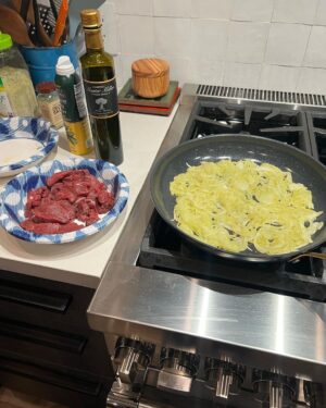 Steve Austin Instagram - Sliced mule deer tenderloin in thin cuts. Sautéed onions in olive oil. Then sautéed tenderloin with garlic and and a pat of butter and mixed them together and seasoned with salt and pepper. 
Fucking delicious. 
Moolah on the ready for clean up…
#venison #muledeer #deer 
#chef #usa #america #wildgame 
@nevadahuntingservices 
@carsonvalleymeats 
#silverlab