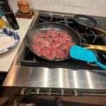 Steve Austin Instagram - Sliced mule deer tenderloin in thin cuts. Sautéed onions in olive oil. Then sautéed tenderloin with garlic and and a pat of butter and mixed them together and seasoned with salt and pepper. Fucking delicious. Moolah on the ready for clean up… #venison #muledeer #deer #chef #usa #america #wildgame @nevadahuntingservices @carsonvalleymeats #silverlab