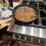 Steve Austin Instagram - Sliced mule deer tenderloin in thin cuts. Sautéed onions in olive oil. Then sautéed tenderloin with garlic and and a pat of butter and mixed them together and seasoned with salt and pepper. Fucking delicious. Moolah on the ready for clean up… #venison #muledeer #deer #chef #usa #america #wildgame @nevadahuntingservices @carsonvalleymeats #silverlab