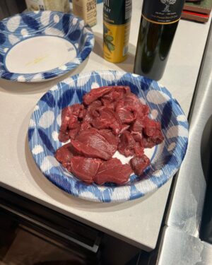 Steve Austin Instagram - Sliced mule deer tenderloin in thin cuts. Sautéed onions in olive oil. Then sautéed tenderloin with garlic and and a pat of butter and mixed them together and seasoned with salt and pepper. 
Fucking delicious. 
Moolah on the ready for clean up…
#venison #muledeer #deer 
#chef #usa #america #wildgame 
@nevadahuntingservices 
@carsonvalleymeats 
#silverlab