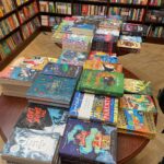 Tamzin Merchant Instagram - Today is the first time I saw #TheHatmakers in the wild! Finding it on a table in @dauntbooks in Marylebone was such a rush - there among other books! 🥰 I signed them too (I asked permission first, it wasn’t a guerrilla signing but I will do that one day) so there are several newly-signed copies of The Hatmakers now on the table at Daunt’s Marylebone! Thanks to lockdowns, though my book was out on the 18th Feb, it’s taken me this long to actually see my book in an actual bookshop! You can’t see my humongous smile, hidden under my mask, but it’s there. It looks like this: 😁 Daunt Books