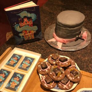 Tamzin Merchant Instagram - I still haven’t really processed that The Hatmakers is out there in the world now! And I definitely haven’t quite snapped back to reality (what even IS reality any more?!) Here are some pics from publication week, featuring a magical hat-cake and Hat-biscuits made by my mum, a small mountain of books at @goldsborobooks and a delightfully fun evening with @thegavgav ✨🎩✨

Thank you SO MUCH to everyone who made The Hatmakers book birthday so special: thank you for your beautiful messages and videos of love and support (Sorry if I haven’t got back to you yet! I am floating on a bit of a cloud at the moment and the phone signal on this cloud is sporadic - also I’m perennially disorganized... finally being a published author definitely hasn’t changed me 😂) 

Thank you especially to everyone who has read the book and sent such lovely messages (and written such kind and generous reviews). I am so immensely grateful for you, and glad that my story that started as a dream is finally a real live book. It’s as much yours as mine now. Thank you for making it feel so welcome in the world 😘 xxx