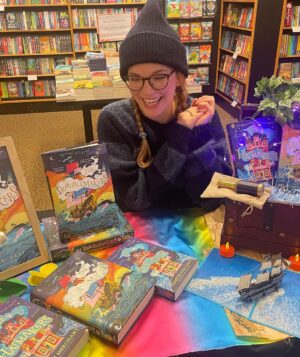 Tamzin Merchant Instagram - I’m on a tiny joyful tour of North London bookshops today, signing copies of #TheTroublemakers ✨🏴‍☠️
First stop, a visit with the truly brilliant @literaryvegan to see her wonderful window display at @waterstonesfinchleyrdo2 ✨🏴‍☠️ Some signed copies are now available there!