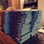Tamzin Merchant Instagram - I had a very fun evening signing a great pile of special edition copies of #TheHatmakers for @waterstones - as you can see, I wrote my name in the front (properly so you can read it not just a squiggle) and there is a special *exclusive* short story called “Lady Elsa Sets a Trend” in the Waterstones version AND veh veh cool blue edges to the pages. The paperback comes out on January 6th! But you can pre-order it now from Waterstones (link in bio) and give your future self a present 🎁 🥳😘 xx