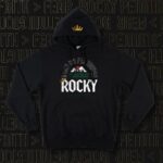 Tecia Torres Instagram - Excited to share Raquel’s champ camp fight shirts, hoodies, and hats! They are up on her website teamrocky.net We decided to go with one shirt design, two different hoodie designs, and two different hat designs. They will be for pre/sale ONLY until Monday. I need to order them asap! I will order some extras but items will be limited so grab them fast! I hope to get them to you by her title fight Jan 20th! I’d like to thank Luke for his amazing designs and overnight service! I highly recommend him. @luke_dehaas Team Rocky! Let’s go. Link in bio as well.