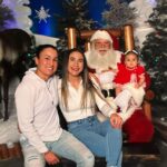 Tecia Torres Instagram - Alayah loved meeting Santa 🎅🏼 She loved playing with his beard and staring at him. She could have stayed all day…Her first Christmas outfit was her Mamas 35 years ago… swipe to see Raquel in it too ♥️ #FirstChristmas #Godbrother #GodParents #Family #Love #RockNado #Holidays