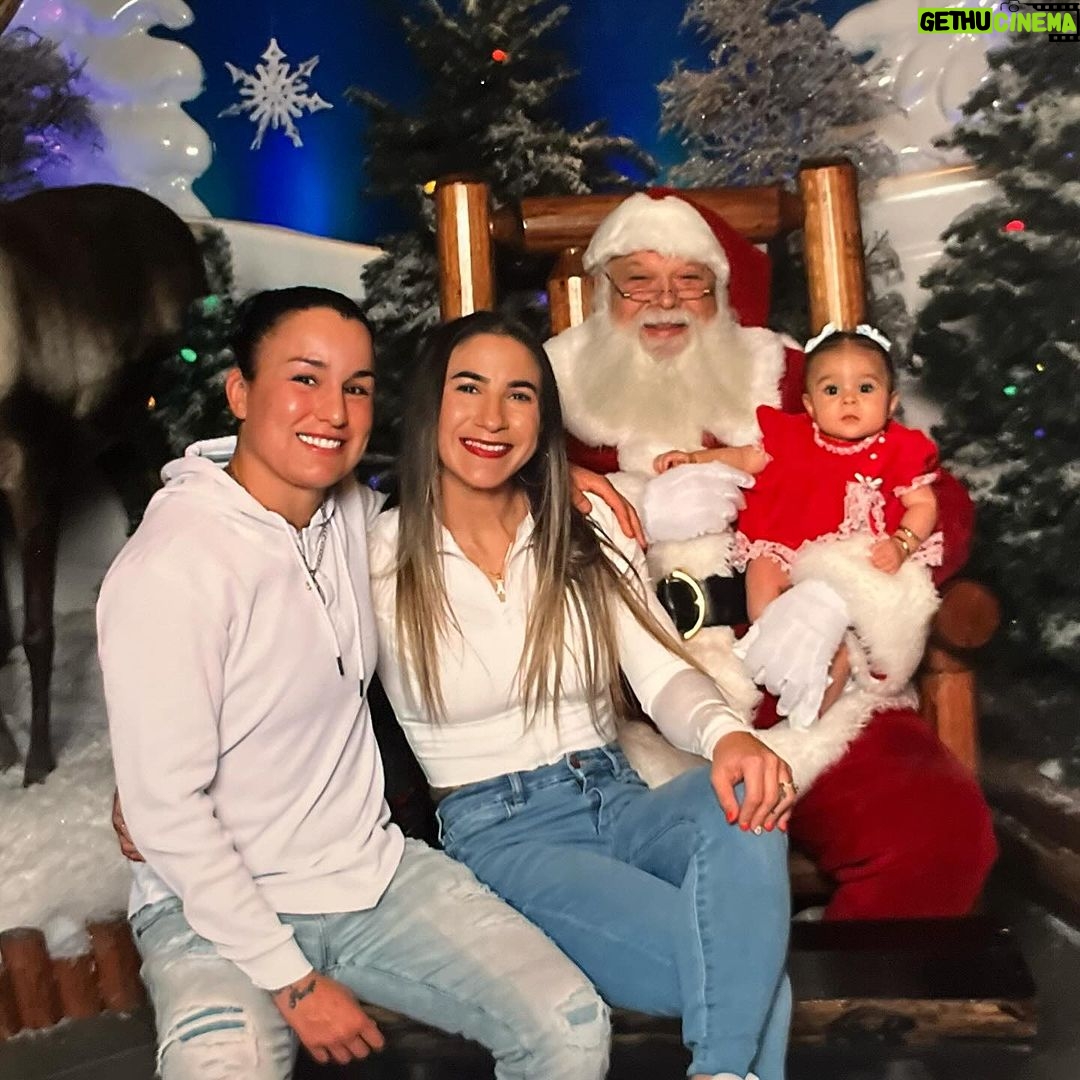 Tecia Torres Instagram - Alayah loved meeting Santa 🎅🏼 She loved playing with his beard and staring at him. She could have stayed all day…Her first Christmas outfit was her Mamas 35 years ago… swipe to see Raquel in it too ♥️ #FirstChristmas #Godbrother #GodParents #Family #Love #RockNado #Holidays
