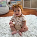 Tecia Torres Instagram - Happy 1/2 Birthday to our beautiful princesa. 6 Months of pure bliss, 6 months of morning smiles, 6 months of baby coos, laughs, and talk, 6 months of making memories. The absolute best 6 months ever! Alayah is sitting up really well, army crawling everywhere, loves her furbaby siblings espically our cat Dubai, enjoys watching moms train, smiles ohh so much, & still on team no sleep. She is 25 inches tall now & still a tiny little one 14 lbs. We are incredibly proud to be her moms. 🩷🥳