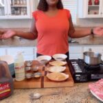 Tiffany Derry Instagram - Fire up the grill! I created Milo’s Famous Sweet Tea Grilled Shortribs using @drinkmilos sweet tea. Ingredients: 2 c. Milo’s Famous Sweet Tea 1 c. Milo’s Lemonade 1 tbsp. sesame oil ½ c. yellow onion, diced 3 tbsp. chopped ginger 5 garlic cloves 1 c. hoisin sauce ¼ c. Worcestershire sauce ¾ c. brown sugar 1 tbsp. paprika 1 tbsp. kosher salt 1 tbsp. fresh ground black pepper 1 tbsp. crushed red pepper 3 lbs. flanken-style beef short ribs, ½ inch thick 2 tbsp. oil, for grilling ¼ c. cilantro, lightly chopped 1 tbsp. White sesame seeds For marinade: In a sauce pot, combine sesame oil, Milo’s Famous Sweet Tea and Milo’s Lemonade. Reduce by half and set aside. In a food processor, combine remaining marinade ingredients including reduced tea and lemonade and process until smooth. For shortribs: Place beef and marinade in a bowl or resealable bag and allow to marinade for a minimum of one hour, preferably overnight. Preheat an outdoor grill or indoor grill pan. Use oil if needed to wipe down. Remove meat from marinade and wipe off excess marinade. Place on the hot grill and cook 3-4 minutes per side. Meat should have a slight char. Garnish with cilantro and sesame seeds. Serve with lettuce and herbs or mashed potatoes.