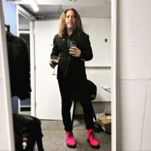 Tim Minchin Instagram - Before I got hot and sweaty playing at the @oldvictheatre Tomorrow Gala. 
EDIT: I managed to fail to mention, when I was on my hunt for these boots, that the aesthetic of the evening was pink, and men were encouraged to wear black cocktail wear with a “splash of pink”. Given that I was headlining and kinda semi-hosting, I panicked when I realized I’d failed in the mission. @drmartensofficial