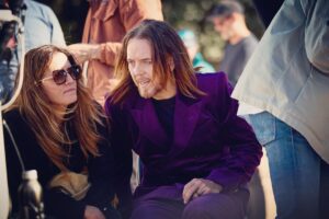 Tim Minchin Instagram - Pap’d during a rare wifely set-visit. 

The suit by none other than @driesvannoten

The photo by none other than 
@damianbennettphoto

Big big (huge) collab coming mid october.