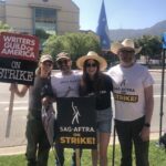 Timothy Omundson Instagram - partial Galavant Family Reunion on the picket lines , today with @mallory_jansen , @johnhoberg & @klikkonthis, in front of our old Employer’s offices. It’s where they count the money hey are making on streaming the show we made them but won’t share a sliver of the pie. By giving @sagaftra & @wgawest fair contracts, or even pretend to negotiate with us in good faith. #sagegastrike ABC/Disney Studios