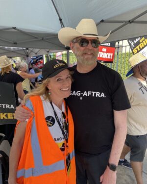 Timothy Omundson Instagram - Captain! Oh my Captain ! Back out on the picket lines today as this hot strike summer continues. Especially honored to be on the line, today with my dear friend and #PsychFamily Sister, @nelsonkirsten. She’s just one of the many badass @sagaftra  #strike Captains , the unsung heroes of our labor movement  These dedicated  #union members are out there in the heat every day , first thing in the morning , keeping us safe, organized, hydrated and in  the case of my skinny, arms, with their pale Irish skin, slathered with sunscreen.  She and her fellow captains are the epitome of #unionstrong  we will keep showing up  until the entertainment oligarchs give us a #FairDeal