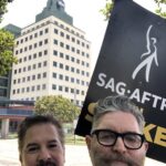 Timothy Omundson Instagram - I got my #SAGCARD 32 years ago on a show with this great dude, @realmarcosanchez We have been dear friends ever since hanging out over that first of Craft Service coffee, we had sitting on the back of the Grip Truck. Proud to be walking the picket lines with him , today and fighting for fair contracts for all @sagaftra & @wgawest members, especially the NEXT generation of actors & writers who have yet to have those opportunities to connect with colleagues over a cup of mediocre coffee , under fair labor conditions ✊🏻#union strong #sagstrong #wgastrobg. ABC/Disney Studios