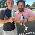 Timothy V. Murphy Instagram - Myself and Jon,walking the picket line,supporting our unions,looking for a fair deal at Fox Studios …oh,and thanks Jay for keeping everyone hydrated @jonhuertas @companyyoukeepabc @prideofgypsies @mananalu.water @sagaftra @writersguildwest #union #unionstrong @sagaftrafound @fox