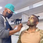 Toby Sandeman Instagram - Had a lot of fun in making Episode 3 Of The Game. A little #Bts commentary to go along with the Slides. ✨✨✨ When I first got sent the script I was going through my process of trying to identify ways to best illuminate what was on the page and the character, Garret Evans himself. And then, I had this Idea!!! Buttttt I knew immediately that if I wanted it to be used come filming time I needed people to FEEL the full effect on the table read which was only hours away from starting. (Showing is always better than telling) ✨✨ I dashed out the house. Hit the Google search and found the closest Army and Navy store. I bought camo face paints & an army fatigue boonie hat and messed around In the mirror until I showed up to the zoom table read ln FULL REGALIA, having NOT told a Soul I was doing so😝😝😝 (Actual footage of how I popped on screen In the table read in Slide 2.) The Roar of laughter was incredible!! Thankfully our Showrunner @devon_greggory, Execs, Writer and Director all loved it and gave the green light 🚦for Garret to wear not only the full face paint but the boonie hat too come time to film. (Slide 3 was the unasked for selfie I sent my showrunner after the table read) 🤣🤣🤣 Slide 4. Tim Moore (@makeupmagician31) our great make up artist saw the vision and went to town using his artistry to make it next level. Slide 5 Is the finished product. Slide 6, 7, 8- is Day one of filming with My Game Gang. Who really took it home playing off of Garrets Intensity, setting up the jokes or slamming them home amazingly. And finally our amazing Director @kelp1031 who really helped me bring my idea and fit it into her vision, guide me through the ep and yet have room to play!! It takes a Village!!!!