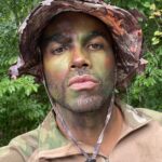 Toby Sandeman Instagram - Had a lot of fun in making Episode 3 Of The Game. A little #Bts commentary to go along with the Slides. ✨✨✨ When I first got sent the script I was going through my process of trying to identify ways to best illuminate what was on the page and the character, Garret Evans himself. And then, I had this Idea!!! Buttttt I knew immediately that if I wanted it to be used come filming time I needed people to FEEL the full effect on the table read which was only hours away from starting. (Showing is always better than telling) ✨✨ I dashed out the house. Hit the Google search and found the closest Army and Navy store. I bought camo face paints & an army fatigue boonie hat and messed around In the mirror until I showed up to the zoom table read ln FULL REGALIA, having NOT told a Soul I was doing so😝😝😝 (Actual footage of how I popped on screen In the table read in Slide 2.) The Roar of laughter was incredible!! Thankfully our Showrunner @devon_greggory, Execs, Writer and Director all loved it and gave the green light 🚦for Garret to wear not only the full face paint but the boonie hat too come time to film. (Slide 3 was the unasked for selfie I sent my showrunner after the table read) 🤣🤣🤣 Slide 4. Tim Moore (@makeupmagician31) our great make up artist saw the vision and went to town using his artistry to make it next level. Slide 5 Is the finished product. Slide 6, 7, 8- is Day one of filming with My Game Gang. Who really took it home playing off of Garrets Intensity, setting up the jokes or slamming them home amazingly. And finally our amazing Director @kelp1031 who really helped me bring my idea and fit it into her vision, guide me through the ep and yet have room to play!! It takes a Village!!!!