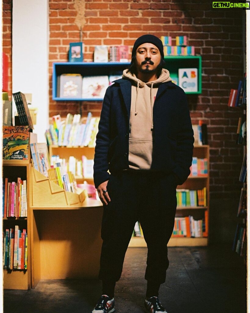 Tony Revolori Instagram - Had a great opportunity to have a brain-fogged chat with Cariann @l.odet and dope dog and pancake filled shoot with @dimitritzoy. Had a blast doing both. Big thank you to @skylightbooks for letting us sneak some photos in the store. Shoes: @onitsukatigerofficial Hoodie: @logic