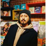 Tony Revolori Instagram - Had a great opportunity to have a brain-fogged chat with Cariann @l.odet and dope dog and pancake filled shoot with @dimitritzoy. Had a blast doing both. Big thank you to @skylightbooks for letting us sneak some photos in the store. Shoes: @onitsukatigerofficial Hoodie: @logic