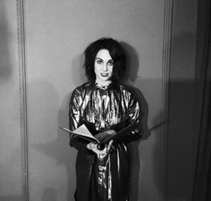 Tuppence Middleton Instagram - Caught mid-read @burberry Christmas dinner. Festive poems courtesy of @pindropstudio & delicious food. Thanks @simon_oldfield for asking me back to entertain the diners & Thankyou #burberry for dressing me up like a funky metallic Christmas pressie 🎀