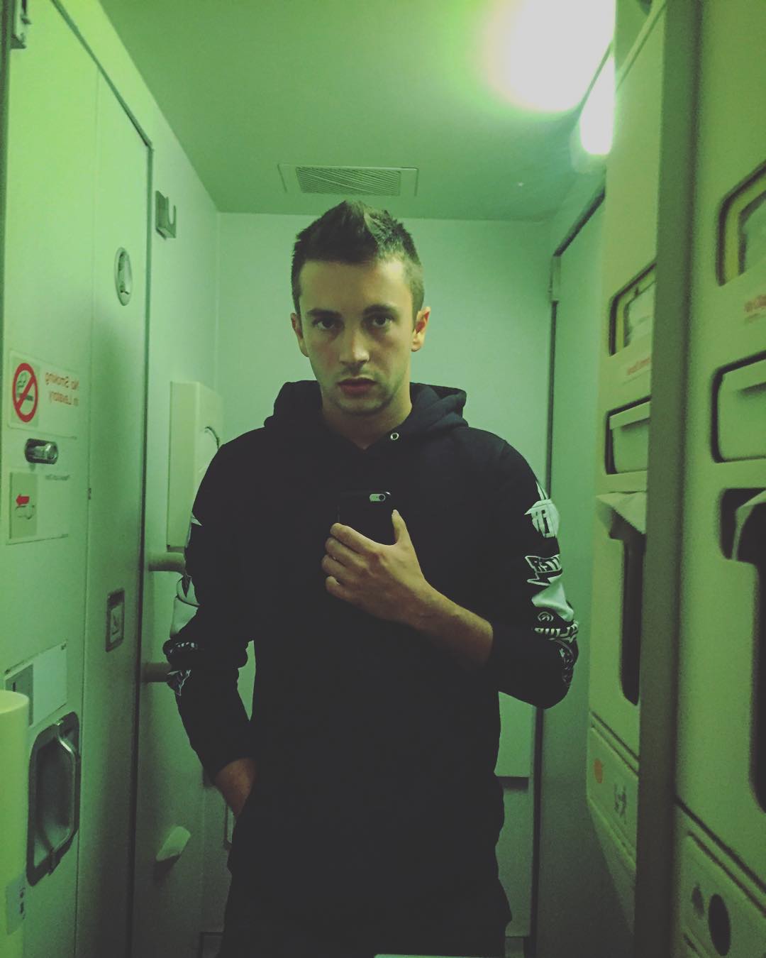 Tyler Joseph Instagram - airplane bathroom photograph of self to prove i am self.