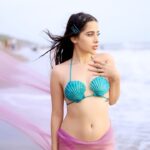 Urfi Javed Instagram - Made this bikini top using shells and wrapped a see through fabric around my legs with nude coloured undergarment ! Ariel is ready ! Hair @geetajaiswal422_ Outfit meeee Make up meee Shot by @the_pixeleyes