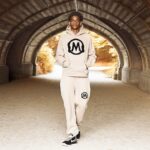 Vanessa Laine Bryant Instagram - Happy Fall Ya’ll! The new Desert Sand collection is available now just in time for the change in seasons 🍂🍁☕️ Special thanks to my nephew @kiyananthony for modeling for this set 💜💜 (link for purchase in bio ) As always, 100% of all net proceeds goes towards creating positive impact for athletes and boys & girls in sports. Thank you for your continued support in furthering Kobe and Gianna’s legacy 🖤🤍 #MambaForever #PlayGigisWay
