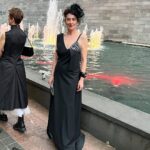 Virginia Trioli Instagram - The beautiful and very moving @ngv summer blockbuster @alexandermcqueen Mind Mythos Muse uses our extraordinary collection to make sense of Lee’s voracious love of art, design, history, myths, literature, textiles and collaborators. So in that spirit I’m wearing a very special dress I bought in 2004 from the much-lamented Flinders Way. Anne Valerie Hash @annevaleriehash is an haute couture designer who was a contemporary of Alexander McQueen and was also a star from the get-go. They were exhibited together in the very early days as emerging artists. Like Lee, Anne Valerie started by deconstructing mens suiting, finding a female form within strict, tailored lines. They both knew how to cut - properly, which is more rare than you’d think. I’m lucky enough to own a few McQueen pieces, including an astonishing boned and corseted black watermarked silk jacket. But this amazing dress is such a dream to wear and deserves to be out of the closet! The headpiece is @neilgriggmillinery from 2005, of silk roses and antique 1920s lace , @lanvin cuff , @anyahindmarch clutch - all my own. It’s a really special show and a great tribute to the imagination and scholarship of @ngv staff, especially @berrydeluxe . Do go see it. A great night. @ngvmelbourne #ngvgala @visitmelbourne #fashion #design #annvaleriehash National Gallery of Victoria