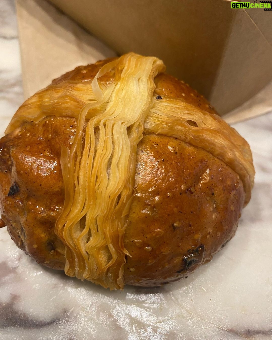 Virginia Trioli - 1.9K Likes - A big shout-out to our neighbourhood baker and roaster, @smallbatchroast and their baker @charliemduffy for winning Easter. I’m a hot cross bun devotee from my early 80s youth, rising on Good Friday at 5am to bake my own for a huge annual gathering of friends, because the only buns you could buy back then were from supermarkets. Then came @babkafitzroy and everything changed. I no longer have to make them because these bakers are way better than I could ever be. I still miss Dolcetti in West Melbourne and Marianna’s extraordinary brioche buns - but these beauties are a brilliant replacement.
All the key elements are there: the spice, the peel and the glaze. The bun has a great give to it and the cross is bloody genius: instead of that line of Clag that bakes into cement, they are clever lines of crisp croissant pastry. 👌
A happy Easter to you all. Eat and share all the good things. #hotcrossbuns #melbourne #easter #food #baking #coffee