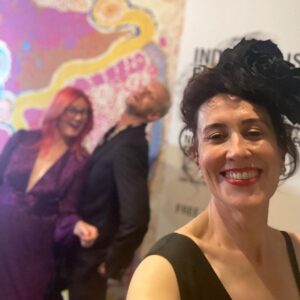 Virginia Trioli Instagram - The beautiful and very moving @ngv summer blockbuster @alexandermcqueen  Mind Mythos Muse uses our extraordinary collection to make sense of Lee’s voracious love of art, design, history, myths, literature, textiles and collaborators. So in that spirit I’m wearing a very special dress I bought in 2004 from the much-lamented Flinders Way.
Anne Valerie Hash @annevaleriehash is an haute couture designer who was a contemporary of Alexander McQueen and was also a star from the get-go. They were exhibited together in the very early days as emerging artists. Like Lee, Anne Valerie started by deconstructing mens suiting, finding a female form within strict, tailored lines. They both knew how to cut - properly, which is more rare than you’d think. I’m lucky enough to own a few McQueen pieces, including an astonishing boned and corseted black watermarked silk jacket. But this amazing dress is such a dream to wear and deserves to be out of the closet!
The headpiece is @neilgriggmillinery from 2005, of silk roses and antique 1920s lace , @lanvin cuff , @anyahindmarch clutch - all my own. It’s a really special show and a great tribute to the imagination and scholarship of @ngv staff, especially @berrydeluxe . Do go see it. A great night. @ngvmelbourne #ngvgala @visitmelbourne #fashion #design #annvaleriehash