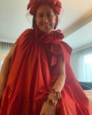 Virginia Trioli Instagram - The @ngvmelbourne gala - go big.
This look is a celebration of independent Melbourne couture: the brilliant @virginiadowzer , celebrated fashion stylist put me together with my old friend 
@karabakercouture and milliner @lisahughesmillinery . The fashion industry in Melbourne stands on the shoulders of brilliant individuals like these and their many years of invention and design and it’s joyous to wear their work. And a side note: the bracelets are a gift from @ysl himself to Virginia Dowzer for Valentines Day many years ago: the stories that make our fashion history. #ngvgala #ngvtriennial #melbourne #fashion #virginiatrioli