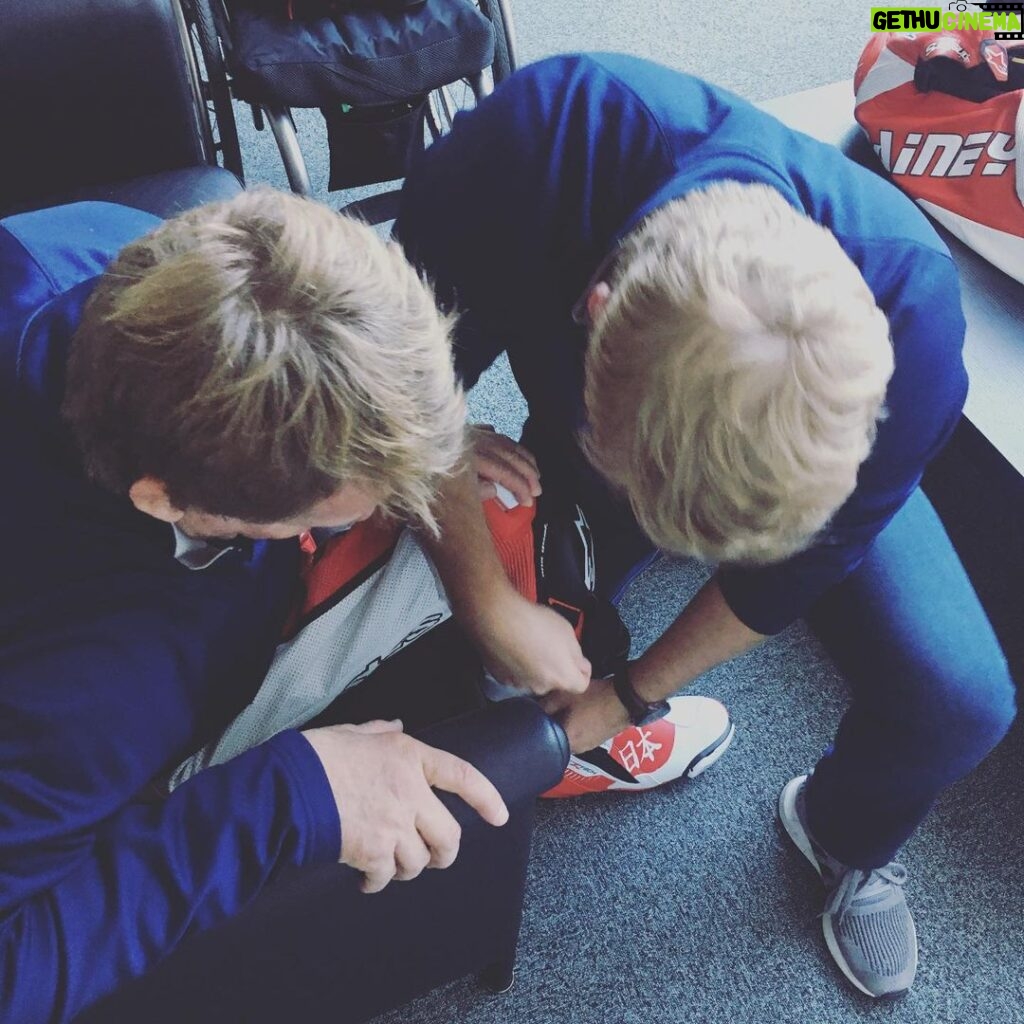 Wayne Rainey Instagram - One of my favorite moments in Japan, my son @rexrainey03 helping me prepare to ride a motorcycle.