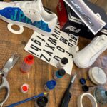 Will Buxton Instagram - Back in Zandvoort, Lawrence and Jolyon set a challenge for the F1TV crew to each design and paint a pair of sneakers for Austin, to be judged and then auctioned for charity. This is my (very F1 nerdy) effort, paying tribute to my favourite F1 livery of all time, the 1993 Ligier JS39 “Art car” designed by Hugo Pratt. It ran for the first time on this weekend exactly 30 years ago with Martin Brundle at the wheel and MB has signed both shoes, which reference the Japanese and Australian GPs at which the livery was used, under his helmet stripes which he very graciously allowed me to use. Will be going up for auction later this week with all proceeds going to @grandprixtrust of which Martin is Chairman. Thanks MB. Big love ❤️ @martinbrundlef1 @lawrobarretto @jolyon_palmer
