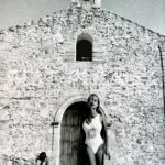 Xenia Seeberg Instagram - Beautiful old cathedral. Shooting for a big swim suit brand. Our photo assistant made an impression in the background… #blackandwhite #photography by @geyrchristian @noodlesfurniture #swimsuit #formentera #blastfromthepast Formentera