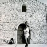 Xenia Seeberg Instagram - Beautiful old cathedral. Shooting for a big swim suit brand. Our photo assistant made an impression in the background… #blackandwhite #photography by @geyrchristian @noodlesfurniture #swimsuit #formentera #blastfromthepast Formentera