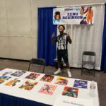 Zeno Robinson Instagram - @dreamconvention was exactly that. A dream come true. I truly love my people, and being surrounded by so many people who look like me, and are into the same things I’m into, truly made me feel at home. I got to link up with my brother @jclh_in_the_morning!! I never got to celebrate what me playing Hawks means to my people, and being able to celebrate not just that victory but all of the blessings God brought to me, at my first in person convention since Hawks and Ogun and Onyankapon, means everything. So many of you came to my table and told me how much it meant to you to see me and hear me on your screens and in your favorite anime and it means the WORLD. It means everything. When you say I inspire you, it’s truly you who inspire ME. I’m humbled, and blessed and driven to work even harder for you and for US. I loved being able to party with my people. I love my people. I love you all!!!! Definitely a highlight of my entire life. Thank you thank you THANK YOU RDC World for inviting me out, and acknowledging me as an artist and actor!! Thank you to @frishmaniac for coordinating and hooking it up. Literally eternally grateful to all of you ❤️❤️❤️❤️ Esports Stadium Arlington