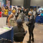 Zeno Robinson Instagram - @dreamconvention was exactly that. A dream come true. I truly love my people, and being surrounded by so many people who look like me, and are into the same things I’m into, truly made me feel at home. I got to link up with my brother @jclh_in_the_morning!! I never got to celebrate what me playing Hawks means to my people, and being able to celebrate not just that victory but all of the blessings God brought to me, at my first in person convention since Hawks and Ogun and Onyankapon, means everything. So many of you came to my table and told me how much it meant to you to see me and hear me on your screens and in your favorite anime and it means the WORLD. It means everything. When you say I inspire you, it’s truly you who inspire ME. I’m humbled, and blessed and driven to work even harder for you and for US. I loved being able to party with my people. I love my people. I love you all!!!! Definitely a highlight of my entire life. Thank you thank you THANK YOU RDC World for inviting me out, and acknowledging me as an artist and actor!! Thank you to @frishmaniac for coordinating and hooking it up. Literally eternally grateful to all of you ❤️❤️❤️❤️ Esports Stadium Arlington
