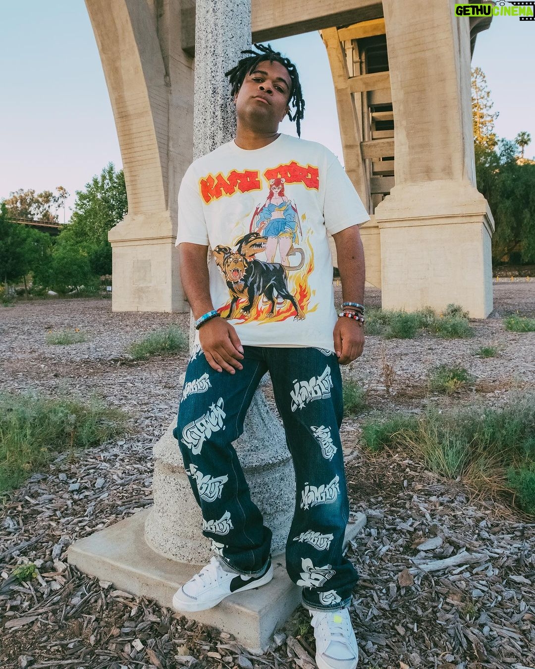 Zeno Robinson Instagram - Devil Hounds Tee Model: Zeno Robinson @childish_gamzeno Zeno: One of the most recognizable voices in the entertainment industry. His journey as an artistic creative lead him to be featured in over 150 films, animations, video games; such as Street Fighter VI and Digimon Adventure. As an English voice actor, his reputation makes him a legend in the anime industry and community. How he maneuvers and presents himself deserves millions of praises. He loves the vision of our brand and raw aesthetics behind this collection. Visit: Kamitori.shop #kamitori
