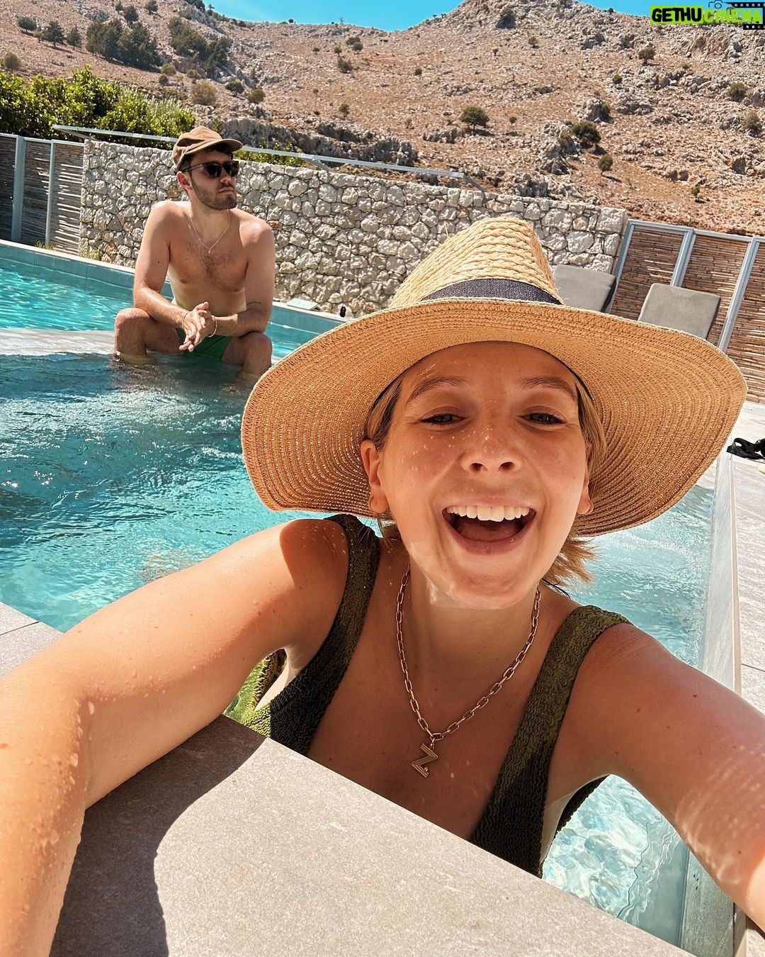 Zoe Sugg Instagram - Thought I’d share some photos from our recent babymoon! We headed to Rhodes and stayed at @casacookhotels which we’d seen Alfie’s fam visit earlier in the year and we instantly knew we’d also love it there. We weren’t looking for a city break or anything with activities (hello third trimester) so somewhere where we could just relax, get massages, read books, dip in the pool & eat delicious food for 5 days was the answer and it was perfect for that! (I’m still thinking about their breakfast buffet) 1. 28 week bump! I don’t feel like I’ve taken half as many photos of my body & bump this pregnancy so we made sure we got some whilst we were away. I actually have a photo wearing this same swimming costume when pregnant with Ottie at around 26 weeks so it’s nice to have them both! 2. Bumpin bumpin. Side note, this swimming costume was an Asos special about 3 years ago and it’s still one of my favourites. Something about the cut that is so flattering and comfy, even with a growing bump! 3. Did a LOT of this! I’m about 300 pages into this book and LOVING it, have you read it? 4. Ate a lot of this, and now I must find somewhere in brighton that sells it 🕵️♀️ (or attempt to make it myself…) 5. Off to breakfast! 6. The main pool area. Loved the mountain backdrop 7. Another off to breakfast shot 8. I pretty much lived in this little section of the pool to keep me and bump cool 9. Off to dinner this time 😂 10. Chilling ☀️ Casa Cook Rhodes