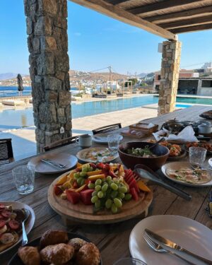 Zoe Sugg Instagram - Mykonos snippets part 2 ☀️ 

1. Early morning paddles in the pool
2. Breakfast spread of dreams
3. Got all dressed up for Alfie’s pre 30th celebrations 
4. Her little face melts me in this photo 🥹
5. The day this happened!!
6. The photo I sent @markyyferris haha
7. Mykonos town 
8. Can you tell I was in a happy little bubble that night? My smile says it all here ♥️ 
9. Ottie embracing the Mykonos wind! Haha
10. Looking at the boats together 🥰