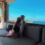 Zoe Sugg Instagram - Mykonos snippets part 2 ☀️ 1. Early morning paddles in the pool 2. Breakfast spread of dreams 3. Got all dressed up for Alfie’s pre 30th celebrations 4. Her little face melts me in this photo 🥹 5. The day this happened!! 6. The photo I sent @markyyferris haha 7. Mykonos town 8. Can you tell I was in a happy little bubble that night? My smile says it all here ♥️ 9. Ottie embracing the Mykonos wind! Haha 10. Looking at the boats together 🥰