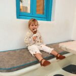 Zoe Sugg Instagram - Snippets of Mykonos ☀️ Was terrible at posting whilst we were away but had so many lovely memories captured I wanted to share! So here is the first of a few Mykonos memory posts 👌 1. Little candid family moment on the beach 2. Ottie loved running in and out of the sea 3. Just loved this photo ♥️ 4. Honestly think she would do this all day if she could 5. In the town! 6. She looked so cute on these stairs 7. Making new friends 🐱 8. 🤤🤤🤤 9. Choosing her ice cream, she could not believe how many flavours there were! 10. Settled on a cookies and cream 😝