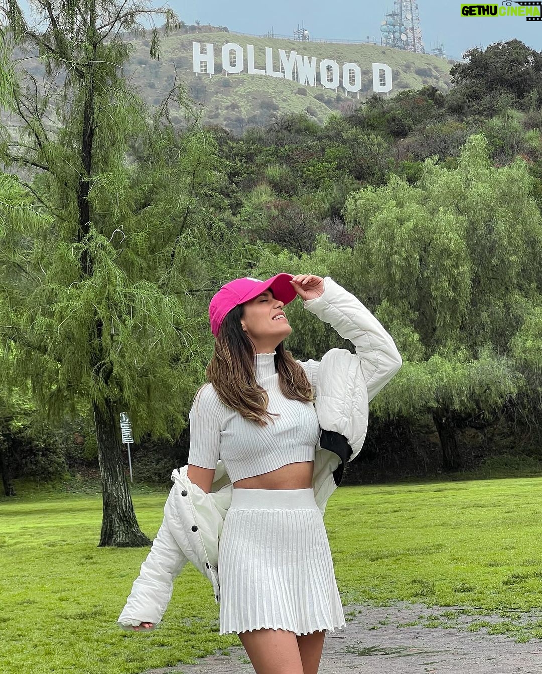 Aakriti Rana Instagram - Made it to Hollywood! 😋 It’s raining here in LA and it’s pretty chilly. The last time I was here was in Feb 2020 and the weather was beautiful and sunny. I’ve pretty much seen a lot of LA but if there’s anything you absolutely love doing here the most or if there’s something really unique then comment below and let me know. Here for a day and then heading to a new place I’ve been meaning to visit since a long time! 😀 P.s look at the doggy doing poo poo with a view! Kya life hai #aakritirana #losangeles #LA #travelblogger #indiantravelblogger #AakritiInUSA #Hollywood #travelphotography #outfitoftheday #familytrip Hollywood, California