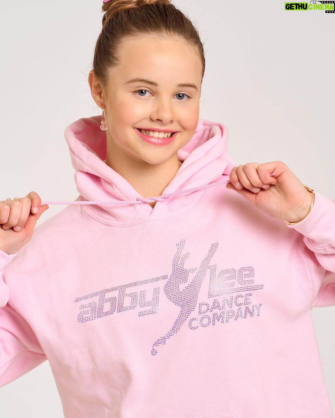 Abby Miller Instagram - The holidays are right around the corner and the Abby Lee Dance Company has you covered! Head over to store.abbyleedancecompany.com or in person @aldcstudiola for some amazing merch including this super cute baby pink rhinestone hoodie 🎀 Los Angeles, California
