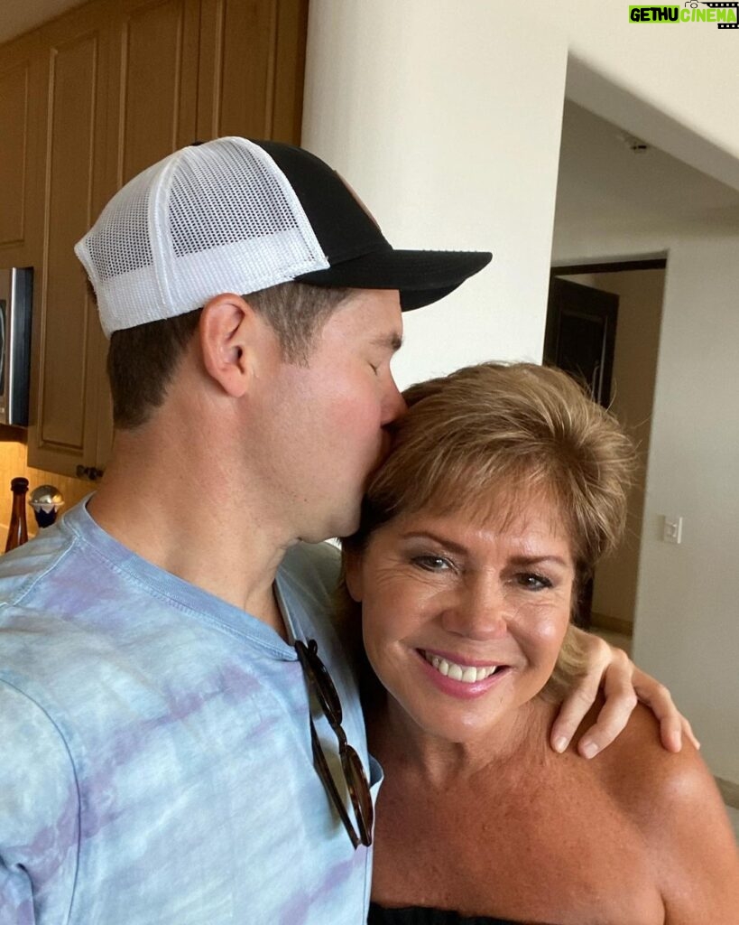 Adam Devine Instagram - It’s #WorldCancerDay! Join me in supporting #StandUpToCancer to help Kiss Cancer Goodbye! Share a kiss (preferably with no COVID) with a loved one (this is my mom on my wedding day) and post it using the #KissCancerGoodbye and tagging @SU2C. Then make your kiss count by donating at StandUpToCancer.org. This organization rocks and cancer is the worst. Donate if you can!